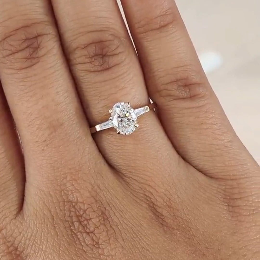 Three Stone Oval Cut with Side Tapered Baguette Cut Engagement Ring