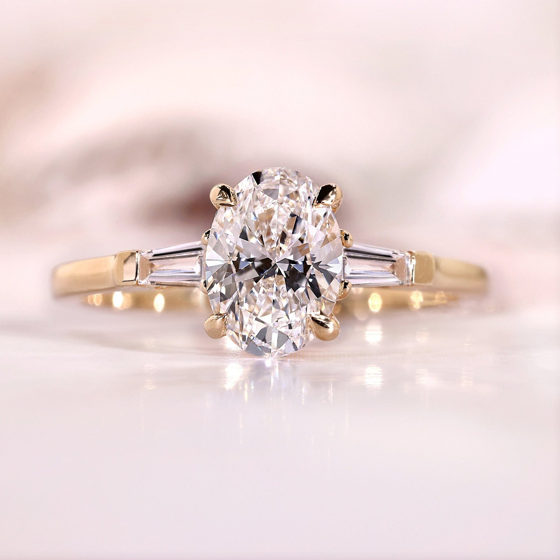 Three Stone Oval Cut with Side Tapered Baguette Cut Engagement Ring