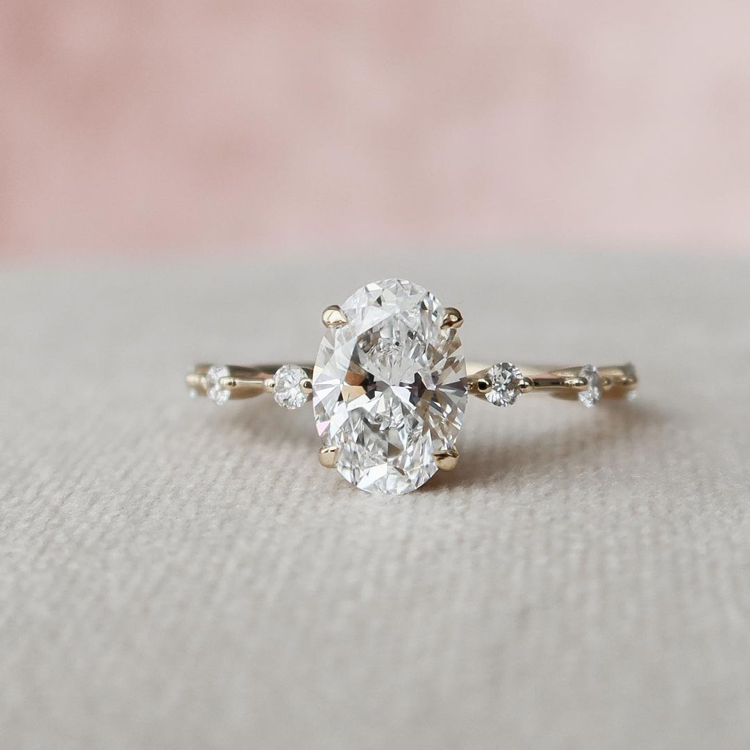 Oval Cut Engagement Ring with Side Stone in Sterling Silver