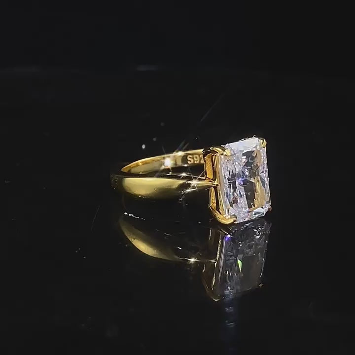 Gleaming Sterling Silver Engagement Ring in Radiant Cut and Golden Tone