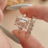 Daity Emerald Cut Three Stone Sterling Silver Bridal Set