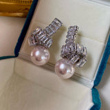 Elegant Pearl Drop Earrings with Baguette Stone Accents