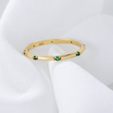 Stylish Golden Tone Wedding Band with Gemstone Accents